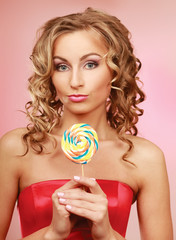 young happy woman with lollipop