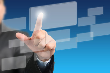 Businessman pressing on touch screen