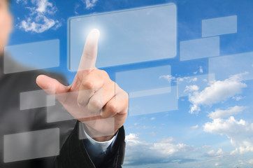 Businessman pressing on touch screen