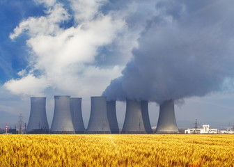 Nuclear power plant with yellow field and sun