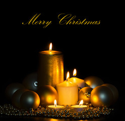 Golden Christmas Candles and spheres on the black