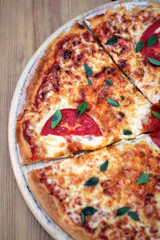 pizza on a wooden plate
