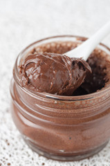 chocolate paste in a glass jar closeup