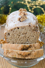 Christmas Banana cake with walnut dusted with icing sugar closeu