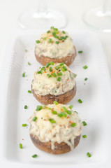 Stuffed mushrooms, baked with cheese and herbs, selective focus