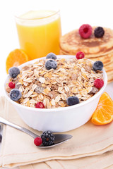 breakfast with muesli,berries and parncakes