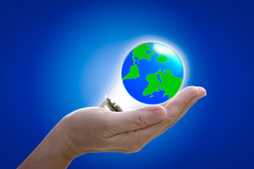 the world in light bulb on the hand