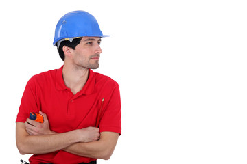 Builder with a tape measure