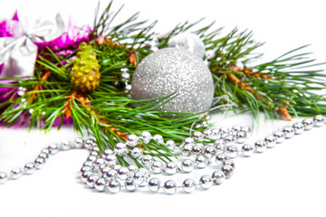 Fototapeta na wymiar Christmas holiday fir tree branch with silver decorations