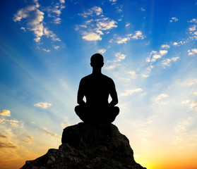 Silhouette of the meditating person