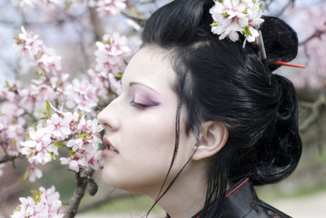 Obraz na płótnie Canvas girl in the garden sakura