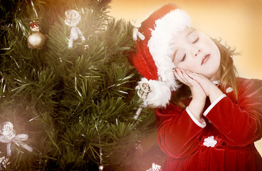 Baby girl under the Christmas tree