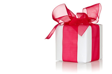 Gift with reflection on white background