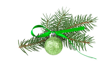 Fototapeta na wymiar green christmas ball with fir branch on white