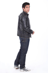 Naklejka premium Young man in a leather jacket