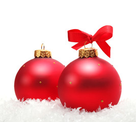 Red Christmas balls in snow