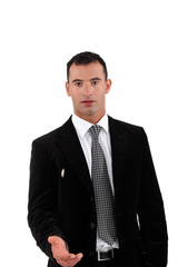Businessman offering you his hand