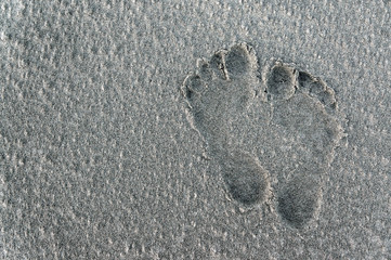 Footsteps on a sandy beach