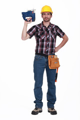 Carpenter holding chainsaw