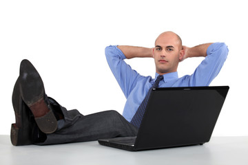 Executive putting his feet up
