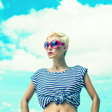 fashion portrait of a girl on a background of the sea