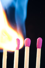 Match bursting to flame, vertical shot, macro