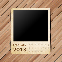 Calendar 2013, blank photo on wooden background