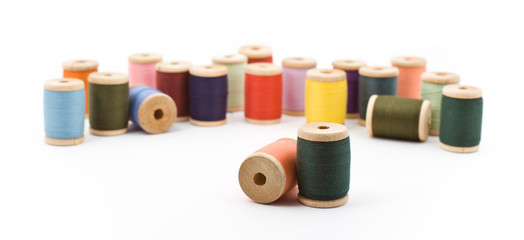 Many bright colored spools of thread