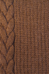 Brown knitted background with scythe
