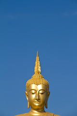 Fototapeta na wymiar Golden Buddha statue in Thailand