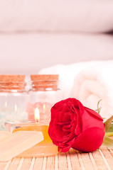 Romantic spa getaway with rose, bath salt and pillows background