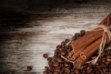 coffee and cinnamon over grunge wood