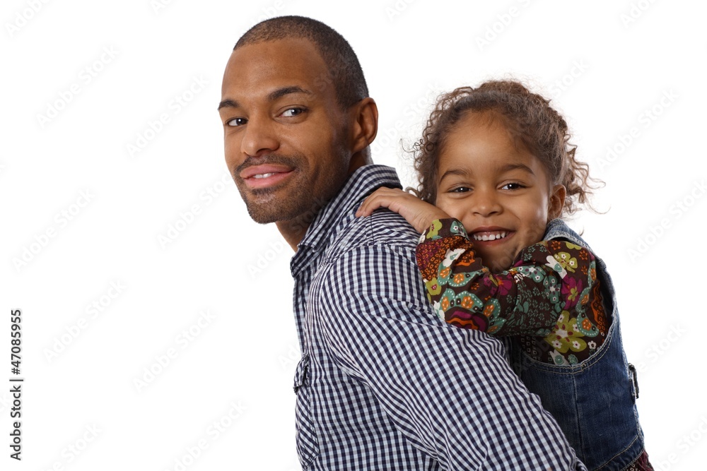 Wall mural Handsome ethnic father and little girl piggyback