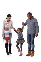 Happy family with little girl walking