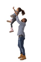 Father throwing little daughter in the air