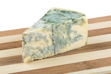 Wedge of soft blue cheese, isolated on white