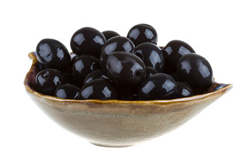 Olives black watered with olive oil in a bowl isolated on a whit