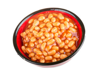Marinated haricot beans in tomato sauce with shallots on a plate
