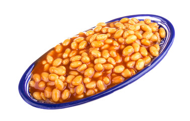 Marinated haricot beans in tomato sauce with shallots on a plate