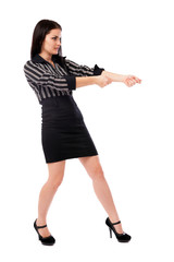 Young businesswoman pulling an imaginary rope