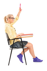 A female student raising her hand trying to ask something