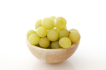 Cluster of white grapes on a white background