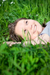 Closeup of a young girl relaxing in grass