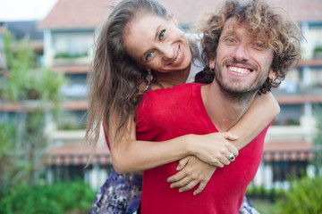 loving couple resting the lawn at the hotel Spa