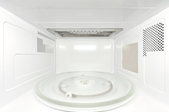 Inside empty microwave oven - frontal view, perspective