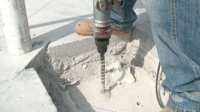 Drilling Hole into Concrete at Construction Site