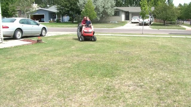 Father & Son on Riding Lawn Mower