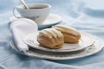 Eclairs with tea