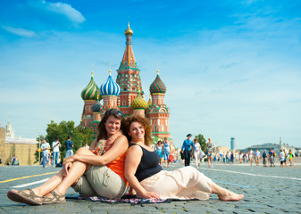 Happy young women visit Red Square