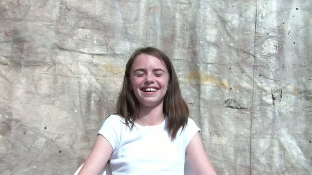 Girl Laughing & Smiling in Sun